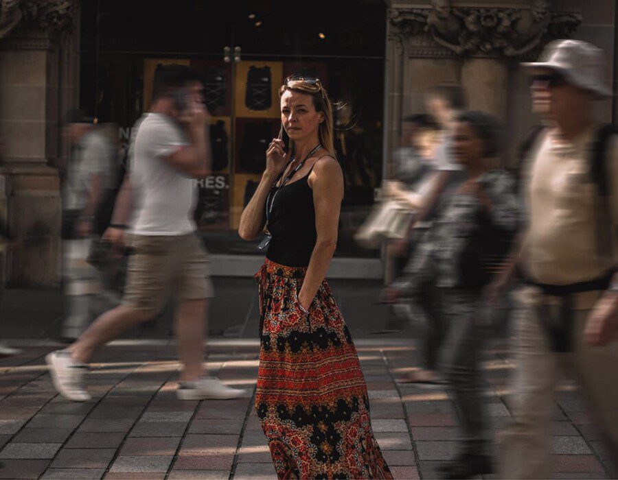 Natalie, standing in a busy street